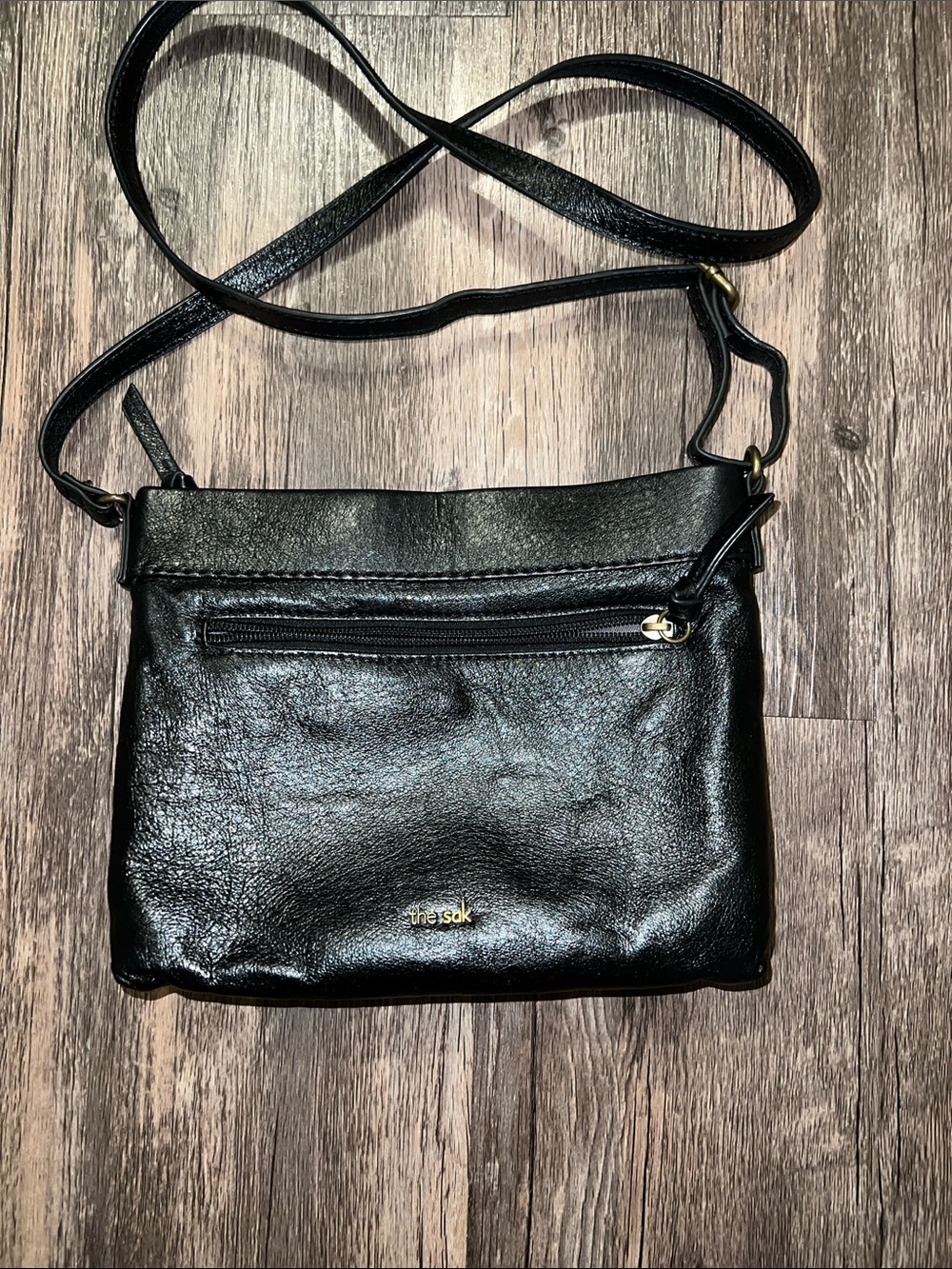 The Sak Black Leather Crossbody Bag with Gold Accent